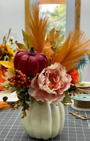 Fall harvest centerpiece with pumpkin and peony